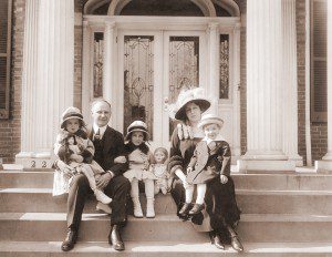 Alvan T. Fuller and family on the steps was taken in Washington, D.C. The date is between 1917-1921, when he was a member of the US House of Representatives.